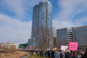 Stamford, CT, USA - January 21, 2017: A group of protesters carry signs in front of Trump Parc apartments at the women's march in Stamford, CT. The Women's March on Stamford was one of hundreds of sister demonstrations in cities around the world to coincide with the flagship event in Washington DC.